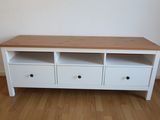 an image of a white tv stand with drawers