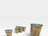 a set of four bronze vases with handles and handles