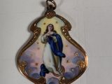 a picture of a religious ornament hanging on a wall