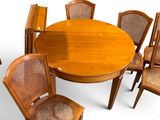 a table with six chairs around it and a table with six chairs around it