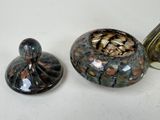 two vases sitting next to each other on a table