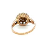an image of a diamond and gold ring on a white background