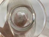 a person holding a glass of water in their hand