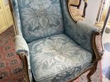 a chair that is sitting on a rug in a room
