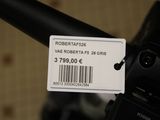 a label on the handlebar of a bike with a barcode attached to it