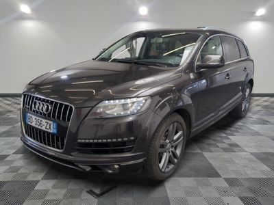 an image of a black audi suv parked in a garage