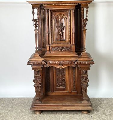 a wooden grandfather clock on a stand in the corner of a room