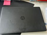 a laptop computer sitting on top of a desk next to a mouse