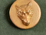 une image représentant une pièce d'or sur laquelle figure une tête de loup