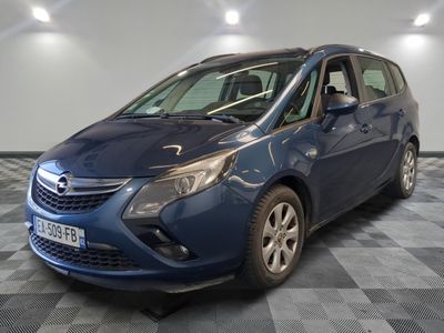 a picture of a blue opel parked in a garage