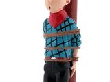 figurine of a man with a hammer on top of a pole