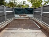 an image of a truck bed with a tarp in the back