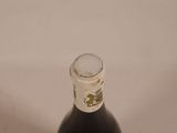 a bottle of wine that is sitting on a table