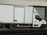 a truck that is parked in front of a building