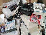 a cardboard box full of electronics and other items