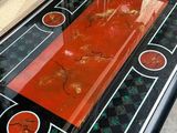 a glass table with a red and black design on it