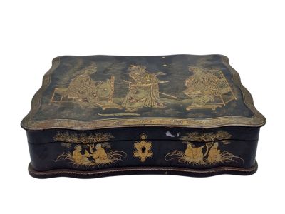 an image of a black box with gold decorations on it