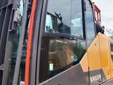 an image of a construction vehicle parked on the side of the road