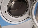 a close up of a washer and a dryer in a room