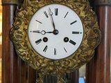 a clock that is sitting in the middle of a room