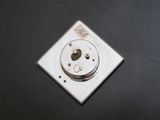 an image of a close up of a button on a black surface