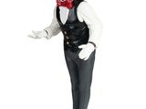 figurine of a man in a tuxedo with a red bow tie