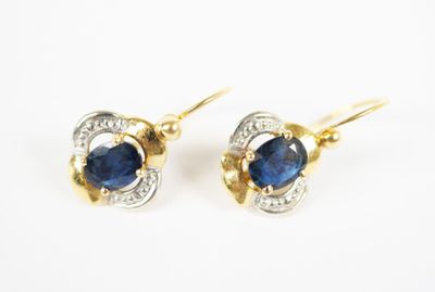 a pair of sapphire and diamond earrings