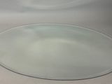 a white sink with a round mirror on it