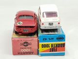 several toy cars are stacked on top of each other on a table