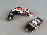 three toy cars that are sitting on a table