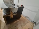 a machine that is sitting on top of a wooden floor