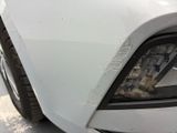 a close up of a car ' s headlight with dirt on it