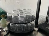 a table with plates and cups on it in a kitchen