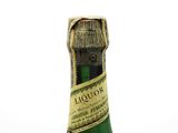 a bottle of wine that is sitting on a table