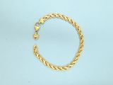 a close up of a gold chain bracelet on a blue surface