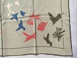 a picture of a handkerchief with birds and flowers on it