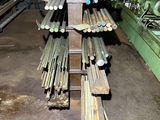 a lot of steel rods that are stacked up in a room