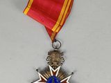an image of a medal with a star on it on a white surface