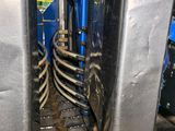 a metal structure that has a bunch of metal parts inside of it