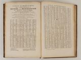 an open book on a table with a bunch of words on it