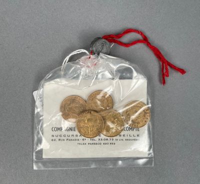 a bag of gold coins sitting on a table