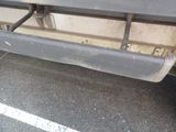 an image of a truck with a flat bed in a parking lot