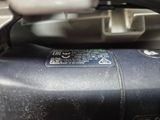 a close up of a motor bike with a sticker on it ' s side