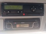 a radio in the dash of a car with a clock on it