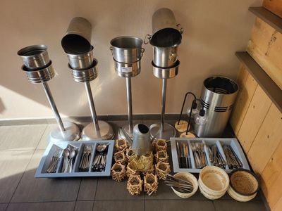 a lot of utensils and spoons sitting on a table