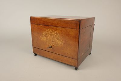 an image of a small wooden box with a decorative design on the front