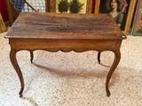 a small wooden table with a drawer on top of it