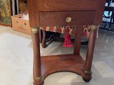 a small table with a book on it in a room