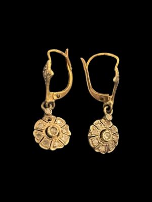 pair of gold earrings from the people of the kingdom of person