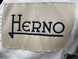a close up of a white shirt with a logo on it